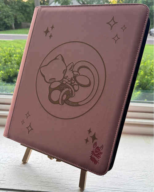 Pink TCG Binder with Mew hugging an Eevee in a bubble mew design.